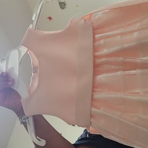 Pink American Princess dress with square pattern and waist belt. Size 2T